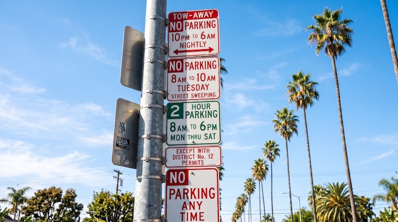 A set of Los Angeles Parking Signs (Arrows, Time Limits, and Permit Exceptions)